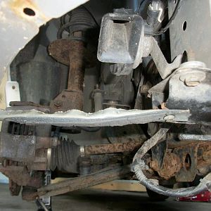Re-used the metal from the hood braces to tie the bumper together