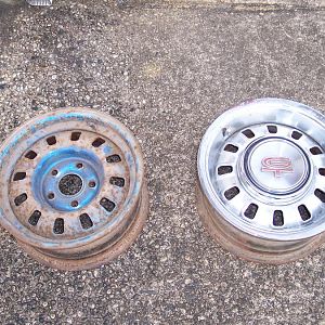 The GT wheels from my old 68 GT Coupe that I want to put on my 69 Coupe. L/S wheel after 20 years of neglect, & R/S wheel after sanding & repainting.