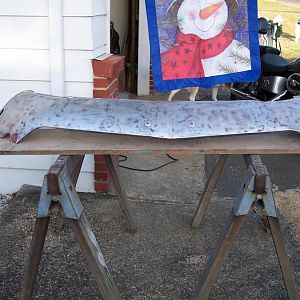 After stripping the old paint from the front valance I found several spots that are in need of repair.