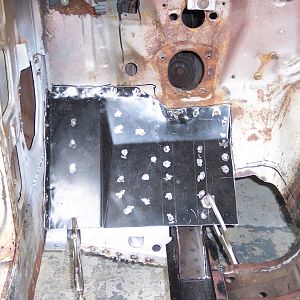 7/30/16 Trimmed & reformed the upper section of the l/s toe board & drilled the spot weld holes.