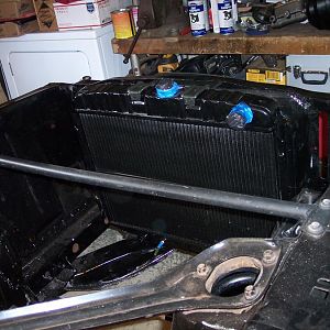 2/19/17 I purchased 2 used lower radiator saddle brackets, cleaned off the surface rust, straightened one of them, painted them, installed them, & ins