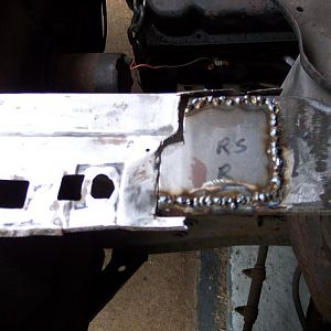 Welded in r/s rear shock tower flange patch.